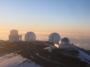 Picture taken from the CFHT catwalk. The domes of the Subaru telescope (left), the twin Keck telescopes and IRTF (right)are visible