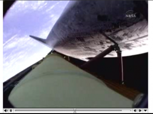 Captured screen from NASA TV showing Earth seen from Atlantis Shuttle half hour after launch.