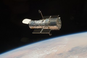 HST after repaired as seen from the Atlantis shuttle (credit NASA)