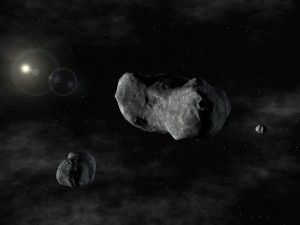 Artist rendering of the triple system: Romulus, Sylvia, and Remus. This is the first triple asteroid system discovered - two small asteroids orbiting a larger one known since 1866 as 87 Sylvia. Because 87 Sylvia was named after Rhea Sylvia, the mythical mother of the founders of Rome, the twin moons are named after those founders: Romulus and Remus. Sylvia's moons are considerably smaller, orbiting in nearly circular orbits and in the same plane and direction.  (ESO PR)