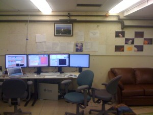 The remote control room at UC-Berkeley. Each screen contains a VNC window to control a specific instrument. On the left everything related to the telescope itself (pointing, focus, dome), in the middle  the guider, then the camera itself (to record the data). I don't really know for what the 4th screen is used yet.