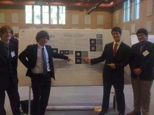 The HMC students in front of their poster