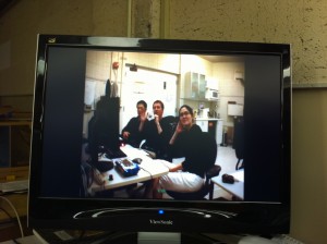 Takayuki, Guy and Elsa ready to start the observations at Lick Observatory and seen from the video conferencing system at UC-Berkeley